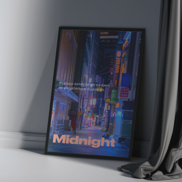 A poster sitting in a frame next to a curtain.