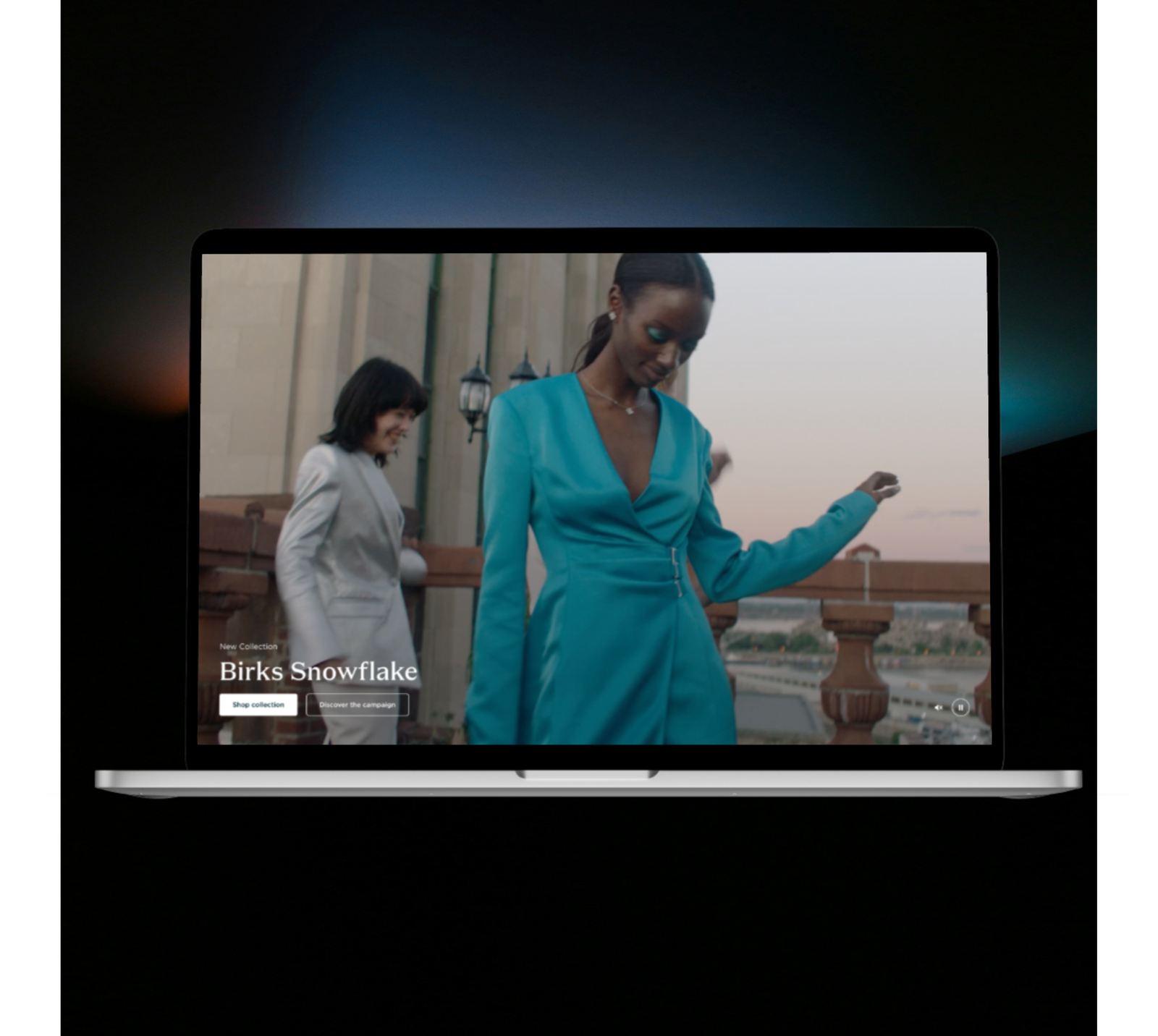 a laptop showing a woman in blue